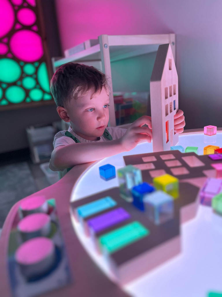 The Light Lab's glowing drawing wall and light-up toys in the dark